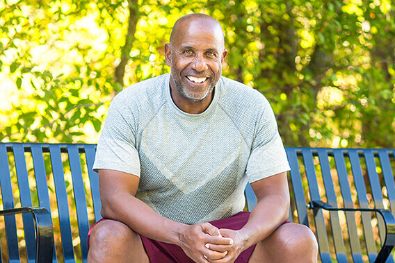 Older Glaucoma Age Man On A Bench